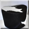 F31. Cow hide footstool. 